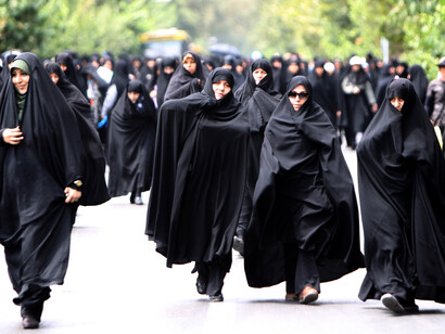 Women with chador in Iran