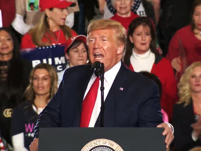 Trump apparently is flattered by the superhero image Q has assigned to him