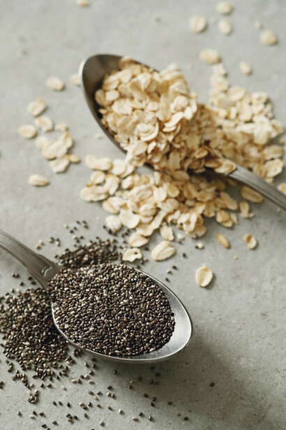Nutrient-rich seeds displayed on a spoon, ideal for supporting hormonal balance and menstrual health