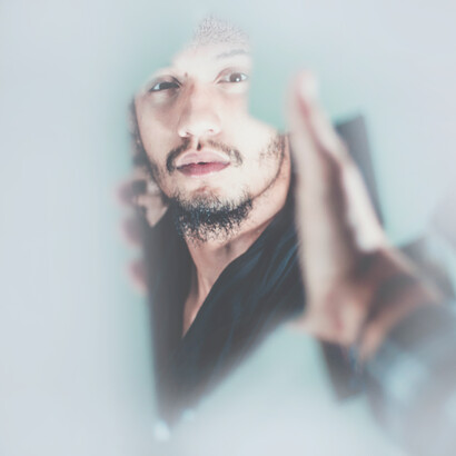The reflection of his pallid face said "Shh! Stop whispering like that"