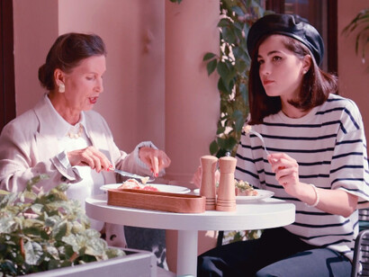 As these two women sit in the peaceful ambiance of a French café, enjoying a delicious breakfast, it's clear that even in difficult times, the small joys of life remain a source of solace and happiness
