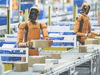 General-purpose humanoid robots working in a fulfillment center, efficiently sorting parcels and transporting packages within a high-tech logistics environment