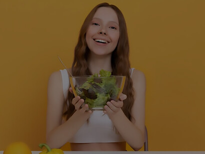 Optimize your content with a medium shot capturing a woman with a selection of healthy food, illustrating the principles of a healthy lifestyle and its positive effects on aging