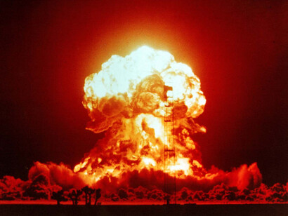 The 1957 nuclear test in Nevada vividly illustrates the destructive power of nuclear weapons, symbolising the deep-seated mistrust that continues to fuel their existence and proliferation