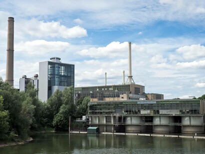 A powerplant encircled by water but using different sources to emit energy