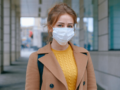 A woman wearing a face mask on the street