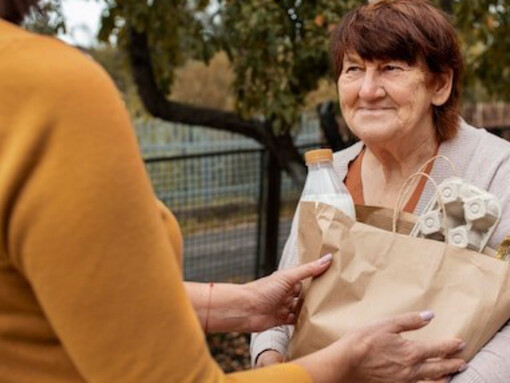 Helping elderly neighbors with supplies, showcasing generosity, reciprocity, and the power of giving and receiving acts of kindness