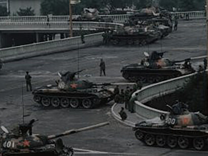 Chinese Army tanks block an overpass on Changan Avenue leading to Tiananmen Square where the Communist Government carried out its final brutal nighttime crackdown on 6/4/89, Peter Charlesworth, Getty Images