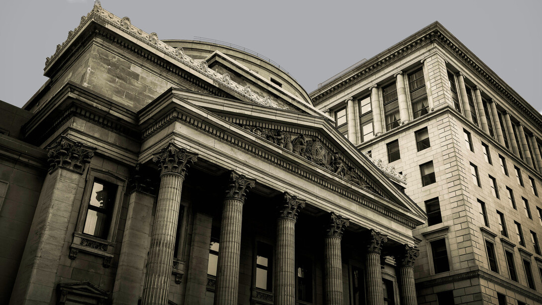 How do centralized politico-economic structures impact our standards of living?