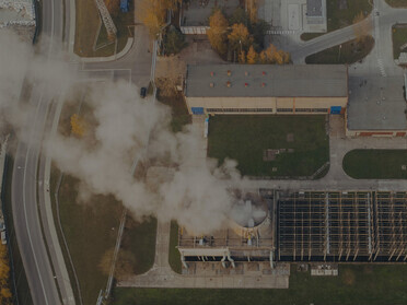 Industrial smokestack emitting white plumes in Poznań, Greater Poland Voivodeship, Poland