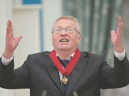 Vladimir Zhirinovsky raising his hands to the sky during his medal-awarding ceremony in Moscow, Russia