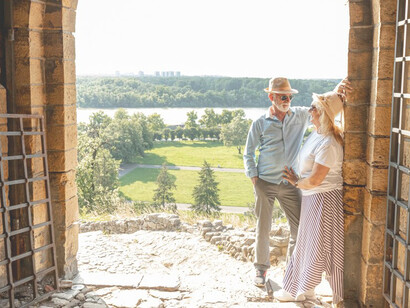 Senior couple relishing the panoramic vistas of Tuscany, Italy, showcasing the charm of tranquil escapes in rural Italy