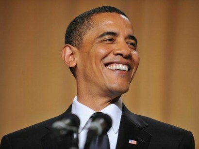 Obama, laughing
