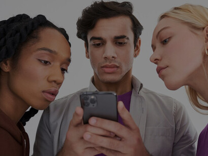 A collective fixated on their mobile devices, actively engaged in reading and sourcing information