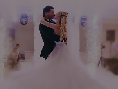 Experience the enchantment of a groom lifting the bride in a dance of newlywed bliss, capturing the essence of love and celebration