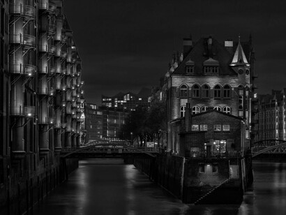 The harmony of old and new architecture over the Nikolaifleet, the canals in Hamburg, Germany, perfectly captures Hamburg's dynamic energy and commitment to sustainability