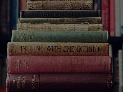 Clusters of aged books standing alongside each other