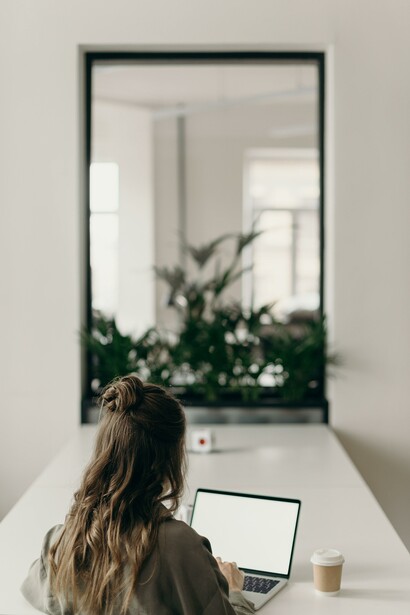 A woman using a laptop at a desk.
Technology is advancing much faster than our capacity to change institutions