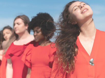 Empowering unity: medium shot of women embracing equality outdoors