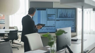 A crisis management leader monitors data to guide decision making in the sports industry