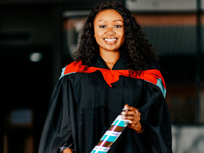 A young woman after her graduation ceremony