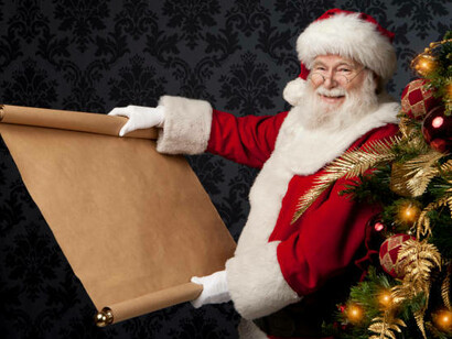 Santa Claus, beaming with holiday cheer, stands next to a sparkling Christmas tree, engrossed in a lengthy list of Christmas dreams
