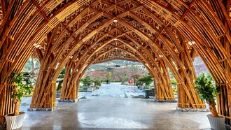 A bamboo structure with layered arches and joints, showing the fusion of traditional knowledge and modern engineering