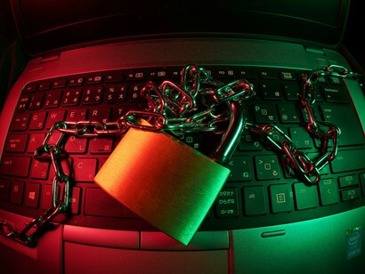 A locked keyboard represents cyberattacks
