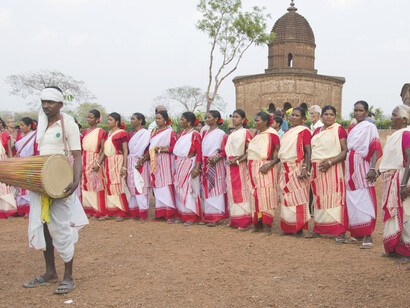 Santhal dance, tribal girls in traditional attire joyfully celebrating a religious occasion, showcasing the vibrant festivities and cultural heritage of the Santhal community in India