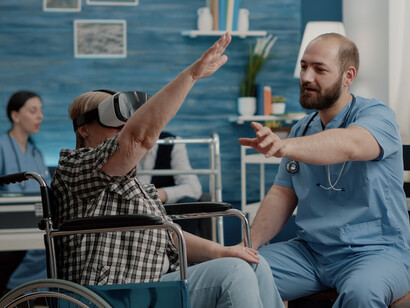 A Danish healthcare worker assists an elderly citizen with care, highlighting the growing demand for skilled professionals in Denmark’s aging population