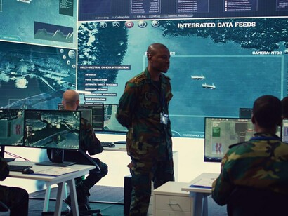 Military officers analyzing real-time data on a holographic display, utilizing advanced technology for strategic decision-making in a modern techno-fascist landscape