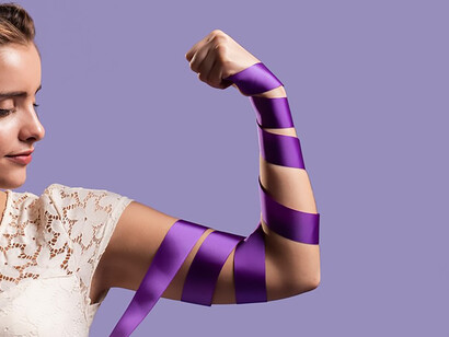 Woman and her arm with purple ribbon