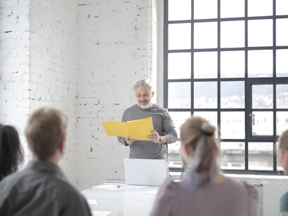 The new leader inspires the team with a vision for the future, embodying the energy and fresh perspective needed to drive the organisation forward