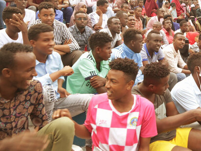 From the stands of a stadium in Mogadishu, Banaadir, Somalia, a united crowd of Somali people gathers, their presence a testament to the collective spirit that transcends adversity and celebrates resilience and unity