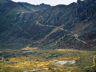 A view of a mountainside with a river running through it in Arunachal Pradesh, India