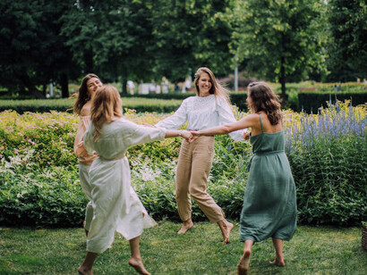 In the garden of friendship, the dance of these women echoes the pages they turn, with each step, they rewrite the script of their lives, guided by the wisdom that they consume