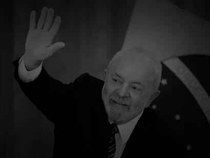 Brazilian President Luiz Inacio Lula da Silva waves as he arrives for a ministerial meeting