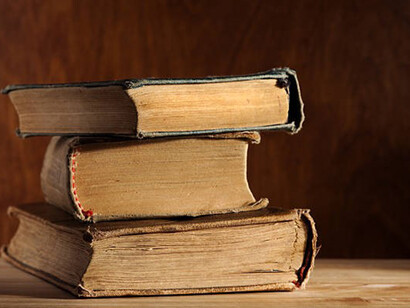 Stack of old books on a table
