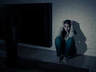 A woman viewing adult content and experiencing guilt