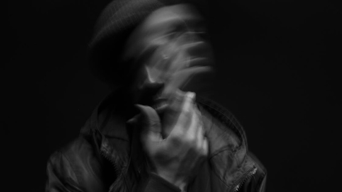 Pondering man staring into the abyss, unsure of himself and his place in the world