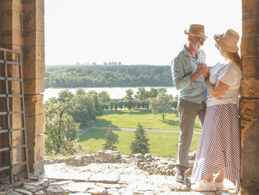 Retired couple savoring the picturesque landscape of Tuscany, Italy, highlighting the allure of scenic getaways in the Italian countryside