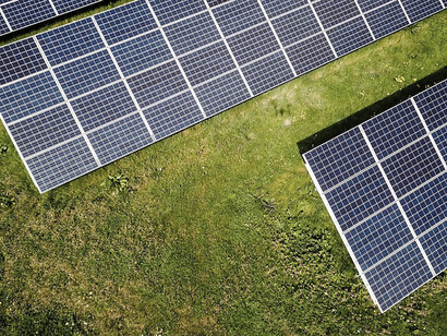 In the photograph, three solar panels are elegantly arranged, capturing the sun's rays with purpose and transforming them into clean and renewable energy
