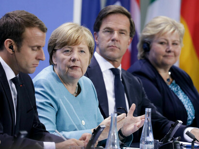 At Berlin summit, EU leaders vow to fight Trump on climate change