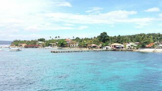 The Ormoc Pier stretching into the sea, symbolising Ormoc’s role as a gateway for people, trade, and opportunity