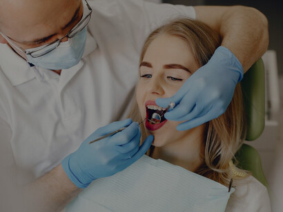 Girl at the dentist's office, emphasizing the connection between a balanced oral microbiome and good oral health, including healthy teeth and gums