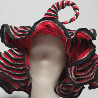 Hat, c. 2001. Metal zippers, thread. Cat Chow, United States. Gift of the Estate of Ruth Horwich. Courtesy of the Chicago History Museum