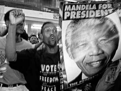 Students cheer and celebrate with a poster of Nelson Mandela at what was then Westville University in the former province of Natal, South Africa, prior to Nelson Mandela's visit at the university in 1994