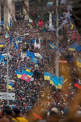 Protesters waiving Ukrainian flag at Maidan protest, Kyiv, Ukraine, 2014