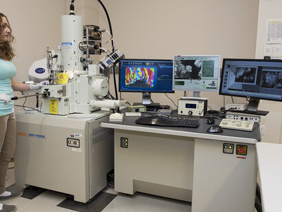 Nicole Overman, a scientist at Pacific Northwest National Laboratory, utilizes the Scanning Electron Microscope (SEM) for high-resolution electron microscopy studies of structural materials