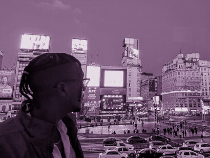 Staring out at the city, Keyshaun contemplates the challenges and opportunities he faces in his work with marginalised communities in Colombia